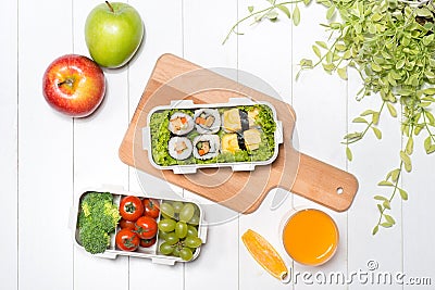 Bento box with different food, fresh veggies and fruits Stock Photo