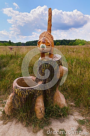 Berendeyevo, Russia, Moscow region, July 26, 2014, summer landscape with fabulous sculptures. Funny ginger cat on the Editorial Stock Photo