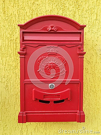  Red mailbox surrounded by greenery in Bergamo, Upper City, famous tourist destination in Lombardy, Stock Photo