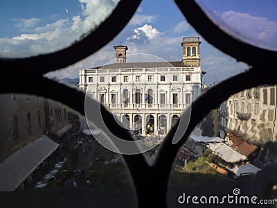 Bergamo. Italy. Landscape at the public library through the Venetian windows of the ancient administration building Editorial Stock Photo