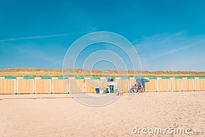 Bergen aan Zee Netherlands beach with blue white beach cottage at the Beach of Bergen aan Zee Holland Editorial Stock Photo