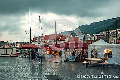 Bergen, Norway - July 30, 2013: Photo of Bergen Waterfront on a rainy evening. The coastline of the port of Bergen Editorial Stock Photo
