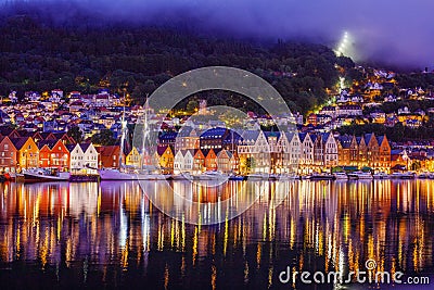 Bergen street at night with boats in Norway Editorial Stock Photo