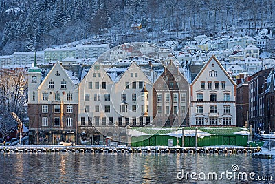 Bergen waterfront cityscape.with pucturesque bryggen houses in light theme in front of the wharf. Looking from across the bay on Stock Photo