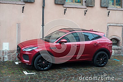 Profile view of red Jaguar E-Pace suv car parked in the street Editorial Stock Photo