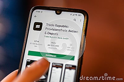 The Trade Republic App is opened in the playstore on an android mobile phone. Editorial Stock Photo