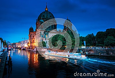 Berlin Cathedral with excursion boat on Spree river, Stock Photo