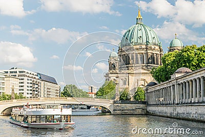 Berlin Cathedral at famous Museum Island with excursion boat river Editorial Stock Photo