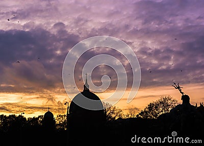 The Berlin Cathedral and the Neptune Fountain under a dramatic sky Stock Photo