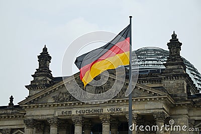 Reichstag building and German Unity Flag Editorial Stock Photo