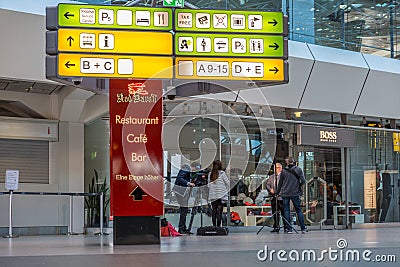 A news team TV is creating content in the empty main Airport Terminal - A, at Berlin Tegel `Otto Lilienthal` Airport, Editorial Stock Photo