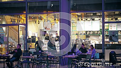 BERLIN, GERMANY - APRIL 30, 2018. Street cafe windows in the evening Editorial Stock Photo