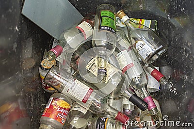 View into a glass container with various bottles for recycling Editorial Stock Photo