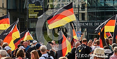 Demonstrators wave the black-red-gold flag of Germany during a demonstration Editorial Stock Photo