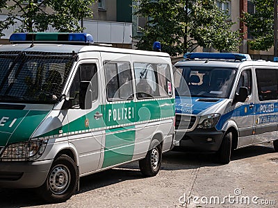 Old Green Police Car And New Blue Police Car In Berlin, Germany Editorial Stock Photo