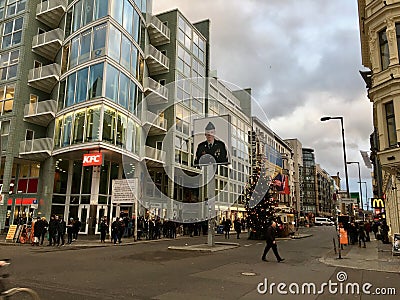 Large Christmas Tree at famous Checkpoint Charlie in Berlin Editorial Stock Photo