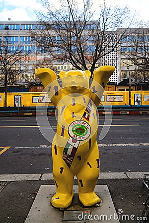 Berlin, Germany - December 02, 2016: Sculpture of a large yellow bear in the street of Berlin Editorial Stock Photo