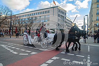 Berlin, Germany - December 02, 2016: White carriage with black horses in Berlin on the street Editorial Stock Photo