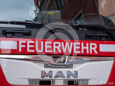 Berlin, Germany - February 09, 2020: The white letters Feuerwehr, the german firefighter logo, on red MAN truck Editorial Stock Photo