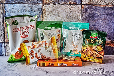 Several packs of snacks from different companies Editorial Stock Photo