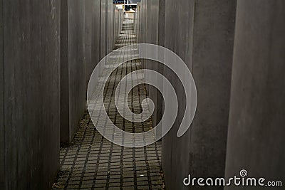 14.05.2019. Berlin, Germany. Holocaust monument. View in the field from concrete slabs of the different size and height. City sigh Editorial Stock Photo