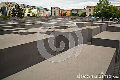 14.05.2019. Berlin, Germany. Holocaust monument. View in the field from concrete slabs of the different size and height. City sigh Editorial Stock Photo