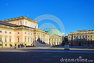 : View to the Bebelplatz in downtown Berlin with the St. Hedwig`s-Cathedral and the German State Opera Editorial Stock Photo