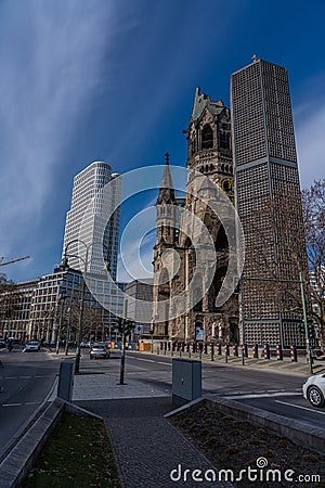 Area around `Breitscheidplatz` and `Ku`damm` with Kaiser Wilhelm memorial church and new build hotel in the center of Berlin Editorial Stock Photo