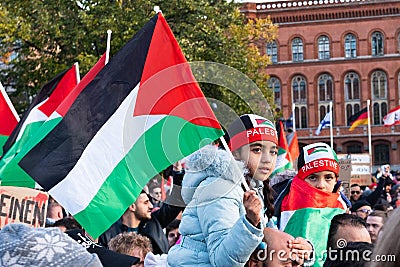 Children with Palestinian flag on Free Palestine Demonstration in Berlin Editorial Stock Photo