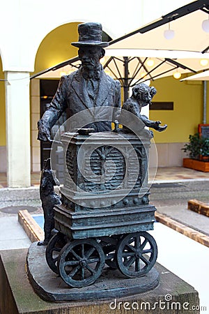 Berlin, Germany - November 9, 2023: Statue of Leierkastenmann, or street organ grinder near Hotel Nikolai Residence in old Editorial Stock Photo