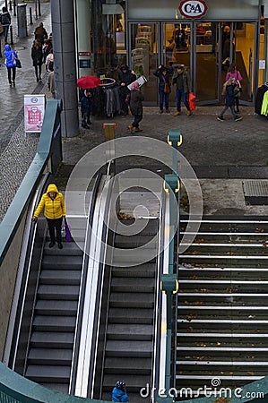 Street scene in Berlin with the entrance of a department store next to the entrance to the subway. Editorial Stock Photo