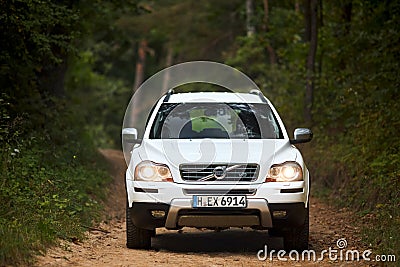 Berlin, Germany - October 3, 2023: Volvo XC90 4.4 v8 1st generation restyling 4WD SUV test drive in fall country road on forest Editorial Stock Photo