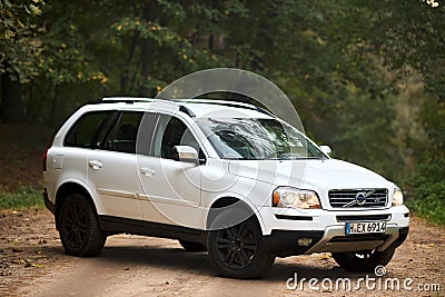 Berlin, Germany - October 3, 2023: Volvo XC90 4.4 v8 1st generation restyling 4WD SUV test drive in fall country road on forest Editorial Stock Photo