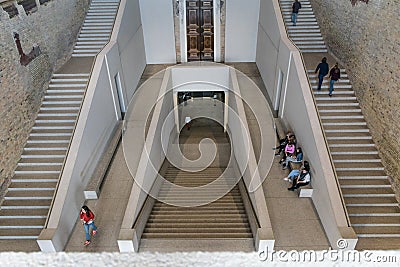 BERLIN, GERMANY - SEPTEMBER 26, 2018: Downwards and symmetrical perspective of tourists resting and going up the Editorial Stock Photo