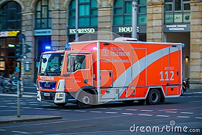 German Ambulance from Feuerwehr Berlin drives on a street to an accident Editorial Stock Photo