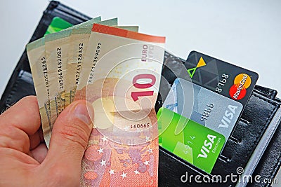 Berlin, Germany - September 4, 2017: Money euro banknotes in man Editorial Stock Photo