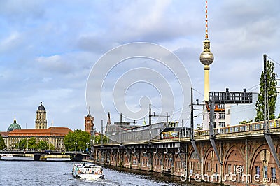 Railway arcades at the river Spree in the center of Berlin. In the background you can see the Red Town Hall, the Alexander Tower a Editorial Stock Photo