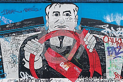 BERLIN - OCTOBER 19, 2016: Artwork depicting communism on the Berlin Wall Editorial Stock Photo