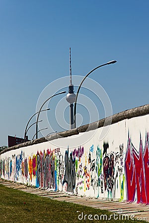 Berlin Wall with graffiti and television tower Editorial Stock Photo