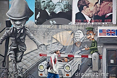 Berlin Wall mural of Check Point Charlie Editorial Stock Photo