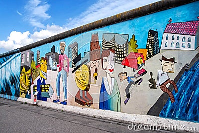 Berlin Wall Painting by Pop Art artist Jim Avignon who painted the East Side Gallery of the Berlin Wall in 1990 Editorial Stock Photo