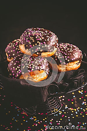 Berliner donuts, filled with jam and colorful confetti Stock Photo