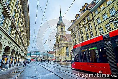 Modern tram rides along Spitalgasse street to Bubenbergplatz in Altstadt district in Bern, Switzerland Editorial Stock Photo