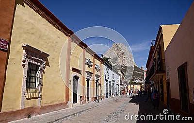 Bernal, Mexico-February 24, 2023: Street in Bernal with Peña de Bernal in the background Editorial Stock Photo