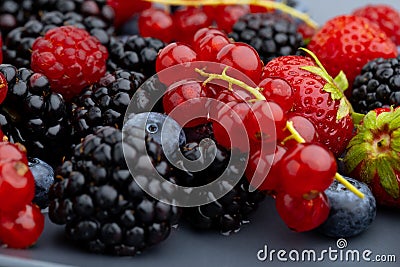 Berries Background. Strawberries, Blueberry, Raspberries, and Blackberry Stock Photo