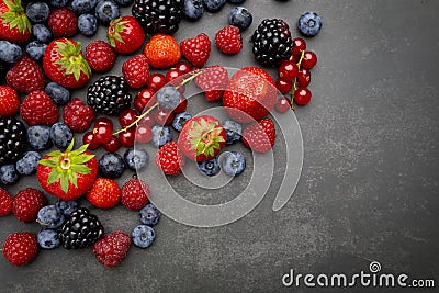 Berries Background. Strawberries, Blueberry, Raspberries, and Blackberry Stock Photo
