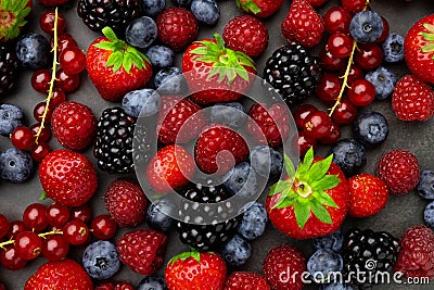 Berries Background. Strawberries, Blueberry, Raspberries, and Blackberry Stock Photo