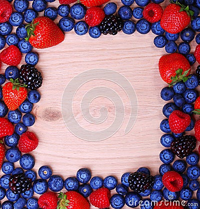 Berries Frame on Wooden Background. Strawberries, Blueberry Stock Photo