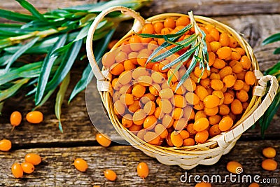 Berries of an organic sea-buckthorn in a basket Stock Photo