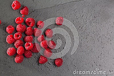 Berries raspberry on black slate background Stock Photo